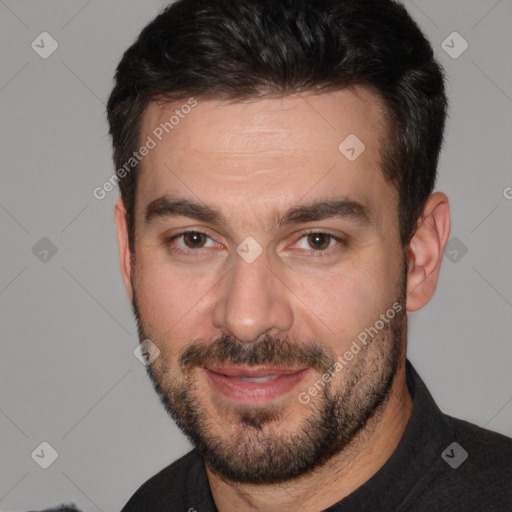 Joyful white adult male with short  brown hair and brown eyes