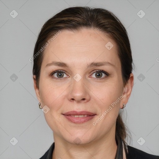 Joyful white adult female with medium  brown hair and grey eyes