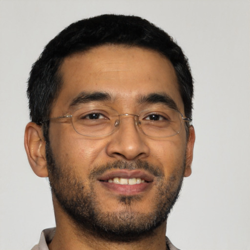 Joyful asian young-adult male with short  black hair and brown eyes