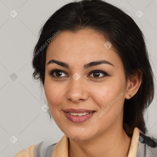 Joyful latino young-adult female with medium  brown hair and brown eyes