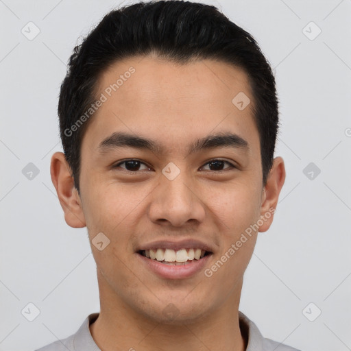 Joyful latino young-adult male with short  brown hair and brown eyes