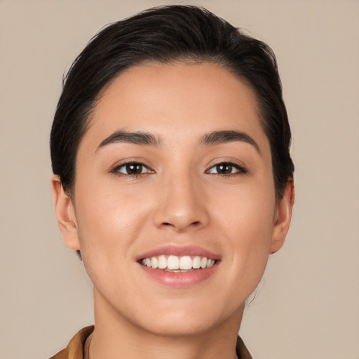 Joyful white young-adult female with short  brown hair and brown eyes