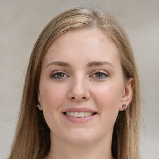 Joyful white young-adult female with long  brown hair and grey eyes