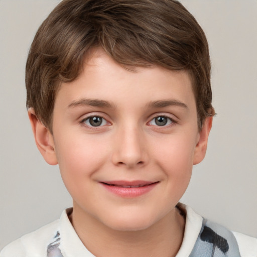 Joyful white child male with short  brown hair and brown eyes