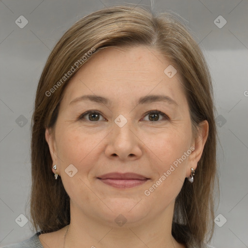 Joyful white adult female with medium  brown hair and grey eyes