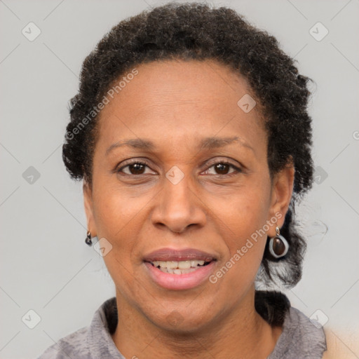 Joyful black adult female with short  brown hair and brown eyes