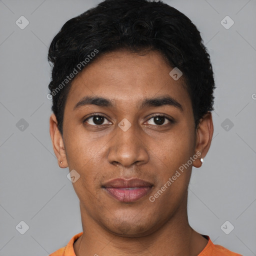 Joyful black young-adult male with short  black hair and brown eyes