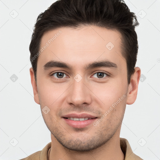 Joyful white young-adult male with short  brown hair and brown eyes