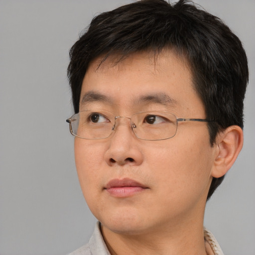 Neutral asian young-adult male with short  brown hair and brown eyes