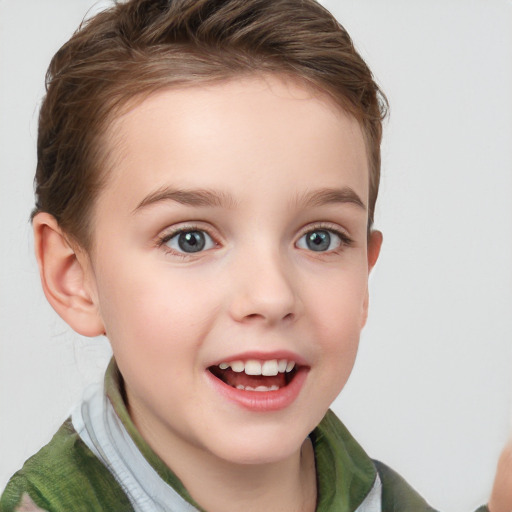 Joyful white child female with short  brown hair and blue eyes