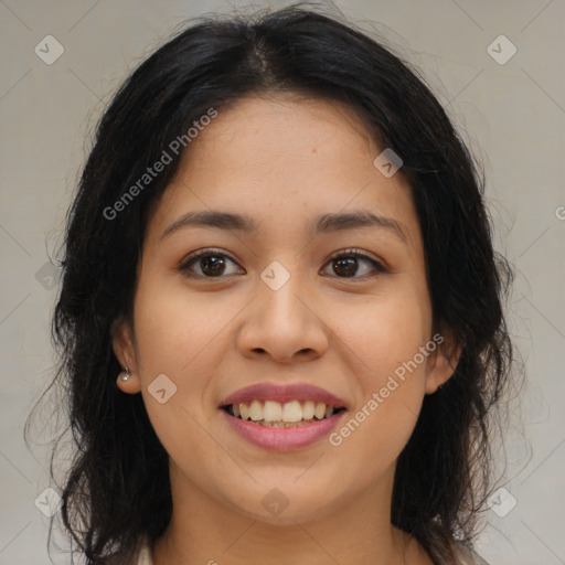 Joyful latino young-adult female with long  brown hair and brown eyes