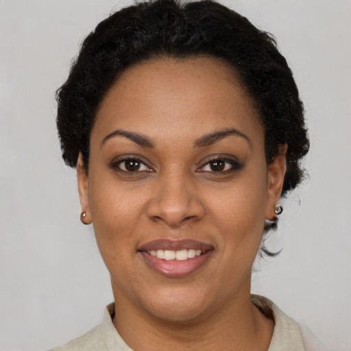 Joyful latino young-adult female with short  brown hair and brown eyes