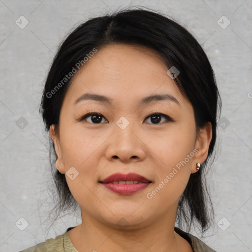 Joyful asian young-adult female with medium  black hair and brown eyes