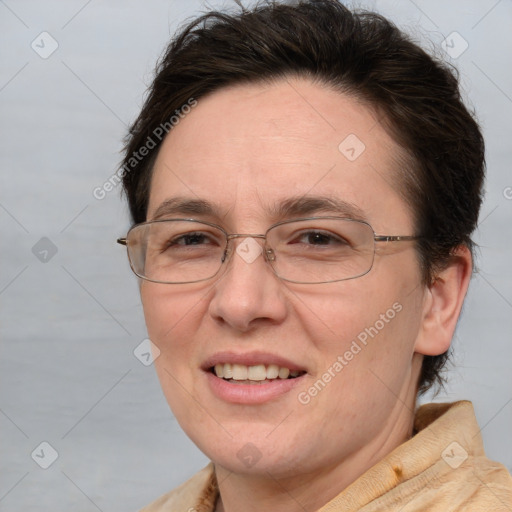 Joyful white adult female with short  brown hair and brown eyes