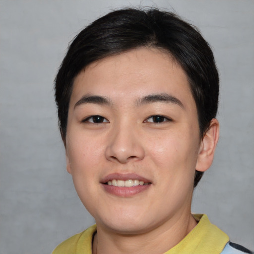 Joyful asian young-adult female with short  brown hair and brown eyes