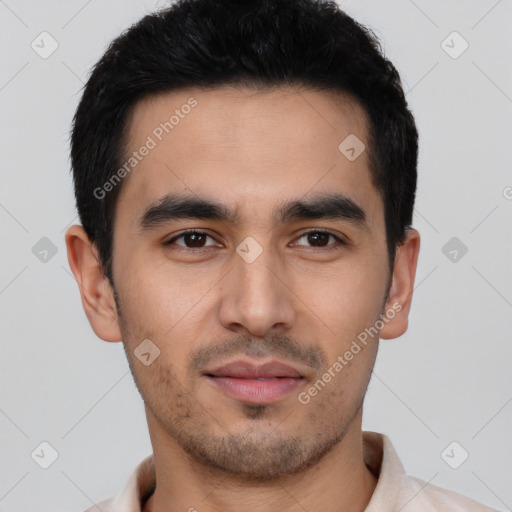 Joyful latino young-adult male with short  black hair and brown eyes