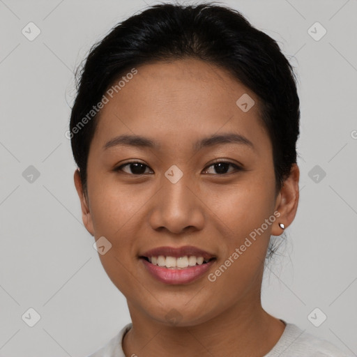 Joyful asian young-adult female with short  black hair and brown eyes