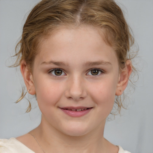 Joyful white child female with medium  brown hair and brown eyes