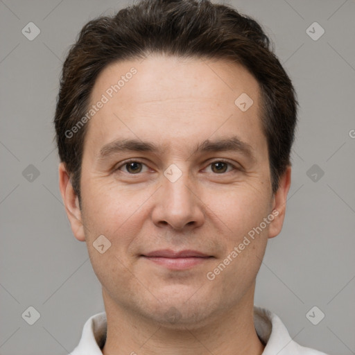 Joyful white adult male with short  brown hair and brown eyes