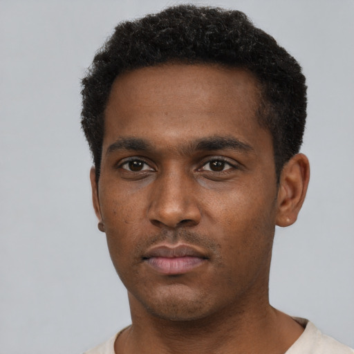 Neutral black young-adult male with short  black hair and brown eyes