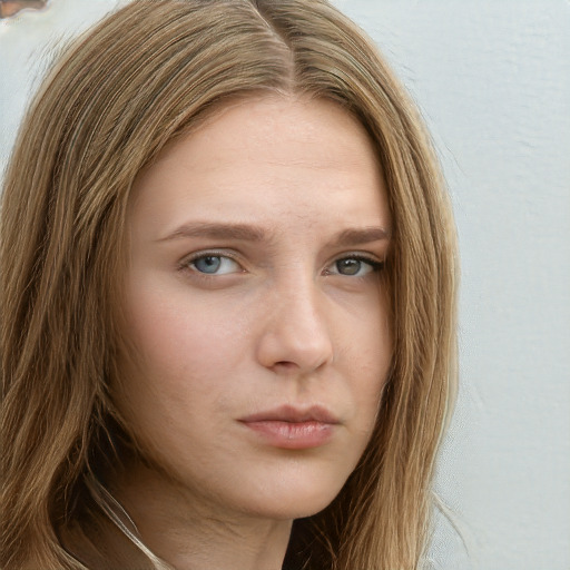 Neutral white young-adult female with long  brown hair and green eyes