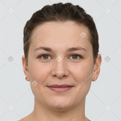 Joyful white young-adult female with short  brown hair and grey eyes