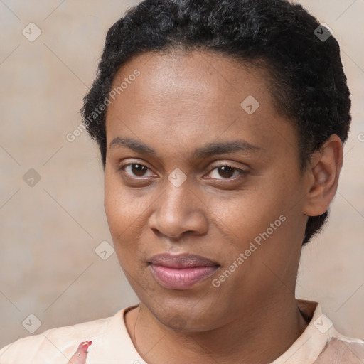 Joyful black young-adult female with short  brown hair and brown eyes