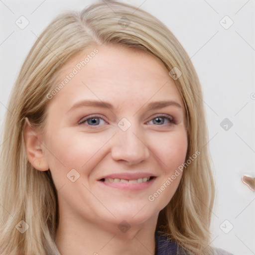 Joyful white young-adult female with long  brown hair and blue eyes