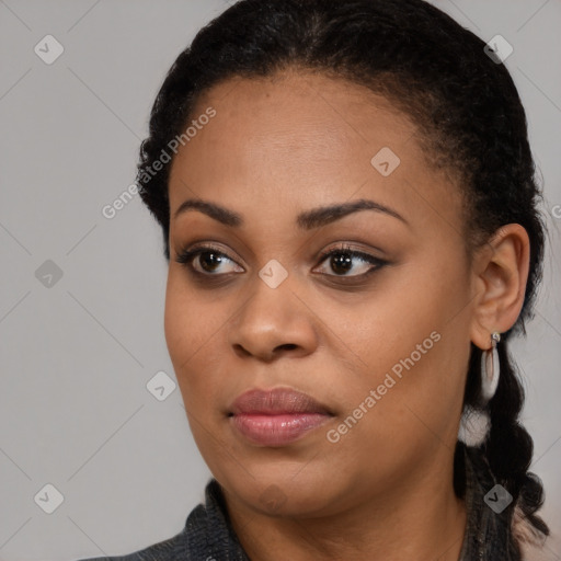 Joyful black young-adult female with medium  black hair and brown eyes