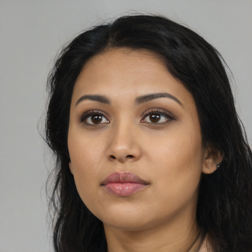 Neutral latino young-adult female with long  black hair and brown eyes