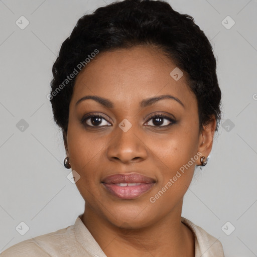 Joyful black young-adult female with short  black hair and brown eyes