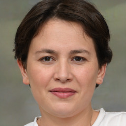 Joyful white adult female with short  brown hair and brown eyes