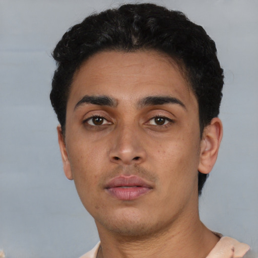 Neutral latino young-adult male with short  black hair and brown eyes