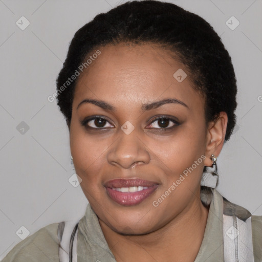 Joyful black young-adult female with short  black hair and brown eyes