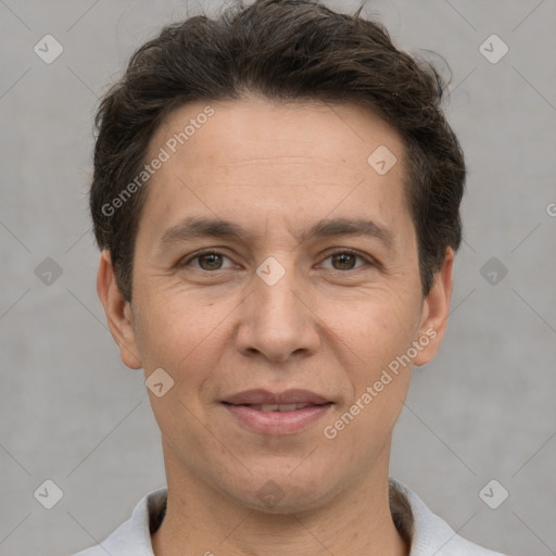 Joyful white adult male with short  brown hair and brown eyes