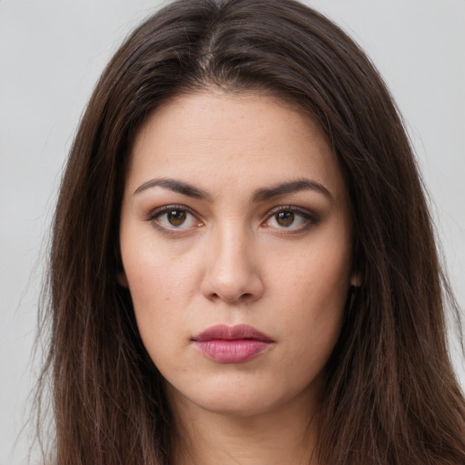 Neutral white young-adult female with long  brown hair and brown eyes