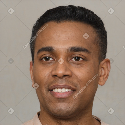 Joyful latino young-adult male with short  black hair and brown eyes