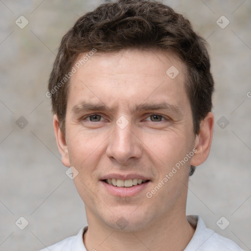 Joyful white adult male with short  brown hair and grey eyes