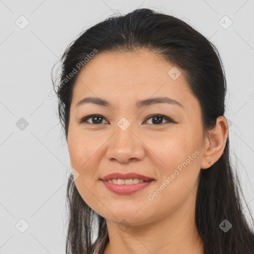 Joyful asian young-adult female with long  brown hair and brown eyes