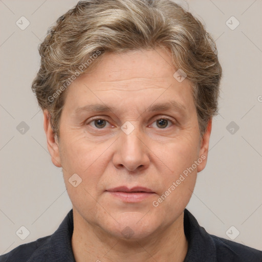 Joyful white adult male with short  brown hair and grey eyes