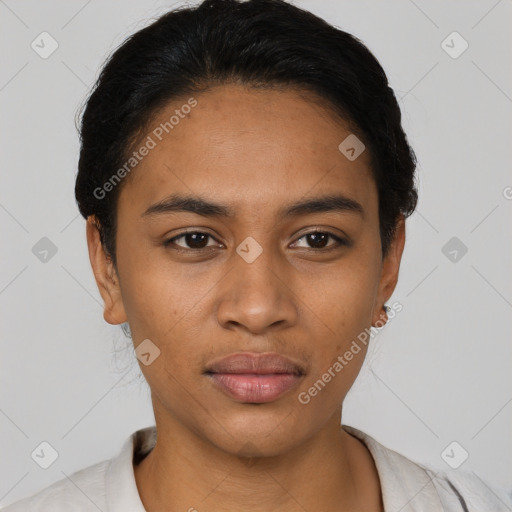 Joyful latino young-adult female with short  black hair and brown eyes