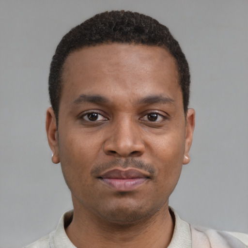 Neutral latino young-adult male with short  brown hair and brown eyes