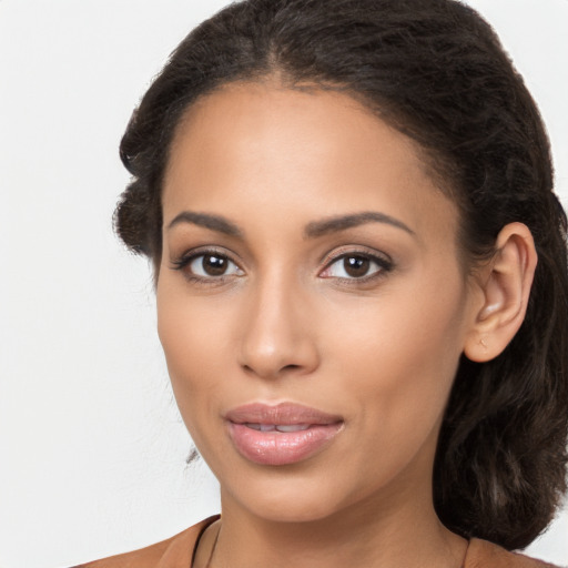 Joyful latino young-adult female with long  brown hair and brown eyes