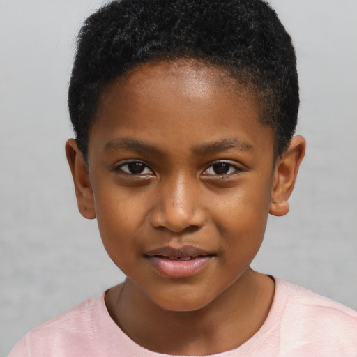 Joyful black child male with short  brown hair and brown eyes