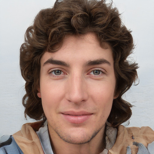 Joyful white young-adult male with medium  brown hair and brown eyes