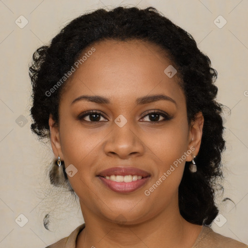 Joyful black young-adult female with long  brown hair and brown eyes