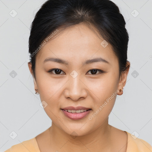 Joyful asian young-adult female with short  brown hair and brown eyes