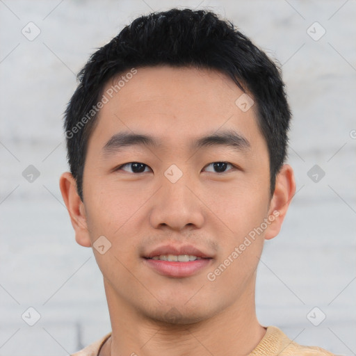 Joyful asian young-adult male with short  black hair and brown eyes