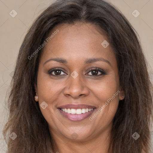 Joyful black young-adult female with long  brown hair and brown eyes