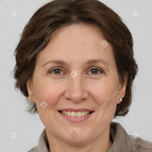 Joyful white adult female with medium  brown hair and brown eyes